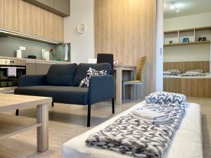 a living room with a couch and a table at Great in Nivy