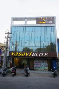 a building with motorcycles parked in front of it at HOTEL VASAVI ELITE in Bāpatla