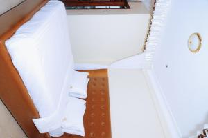 Postel nebo postele na pokoji v ubytování kadaali guesthouse