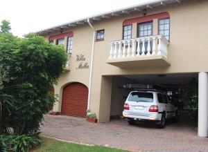 a white van parked in front of a house at Villa Stella Guest House in Edenvale