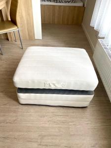 a mattress sitting on a floor in a room at KamzikTower View - One in Nivy