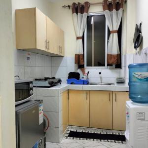 a small kitchen with a sink and a stove at CND Luxury Homes in Mombasa