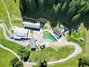 an aerial view of a farm with a building at Köpfle Alpe in Balderschwang