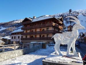 a statue of a deer in front of a building at Studio Valloire, 1 pièce, 3 personnes - FR-1-263-54 in Valloire