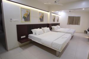 Hotel Haldi客房内的一张或多张床位