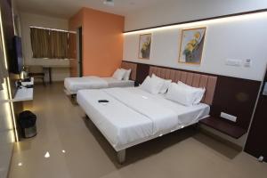 Hotel Haldi客房内的一张或多张床位