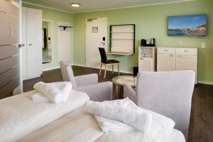 Ein Bett oder Betten in einem Zimmer der Unterkunft Insulaner Dependance