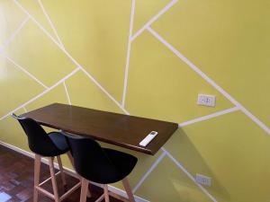 a table and two chairs in a room at Share in Buenos Aires