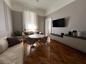 TV a/nebo společenská místnost v ubytování Turin Central Cavour