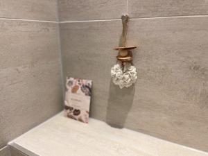 a book sitting on a shelf next to a bird house at Luxe voor 2 in het heuvelland-De Trekvogel in Vijlen +17 photos