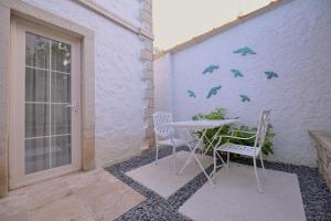 En terrasse eller udendørsområde på Peremere Alacati Otel