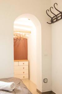 a bedroom with a bed and a dresser at VILLA MIAMI in Miami Platja +32 photos