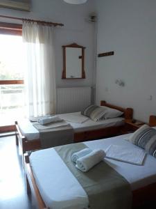 Cama o camas de una habitación en Ntaskas apartments