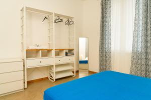 A bed or beds in a room at Casa Relax Mondello