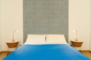 A bed or beds in a room at Casa Relax Mondello