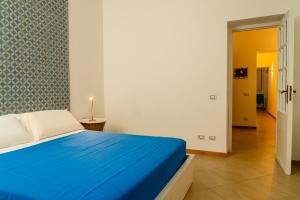 A bed or beds in a room at Casa Relax Mondello