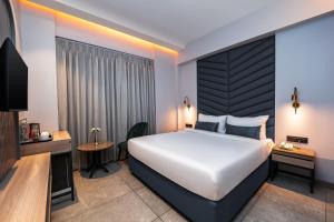 Postel nebo postele na pokoji v ubytování Ajanta Continental-Mumbai Airport