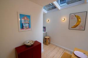 a living room with a banana on the wall at Stunning Broadstairs 5 bed Family Hse, Parking, Garden in Kent