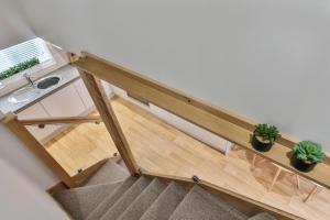 an overhead view of a staircase with potted plants at 1BR Gem in Great Location With Parking in Sheffield