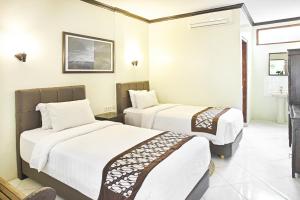 Lova arba lovos apgyvendinimo įstaigoje Paku Mas Hotel