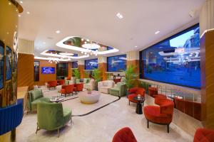 a waiting room with colorful chairs and a large window at Hotel Eyfel in Istanbul