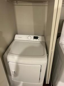 a white toilet in a small room with at Amazing Stay in Las Vegas