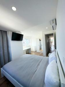 Giường trong phòng chung tại Fantástico T3 Porto - 6 Pessoas