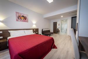 Postel nebo postele na pokoji v ubytování Hotel Cajeta