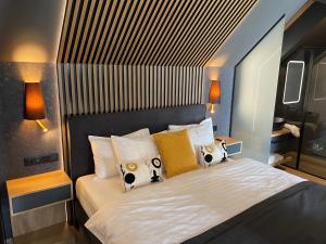 Posteľ alebo postele v izbe v ubytovaní M26 Prémium apartmanok