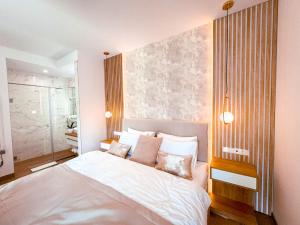 Posteľ alebo postele v izbe v ubytovaní M26 Prémium apartmanok