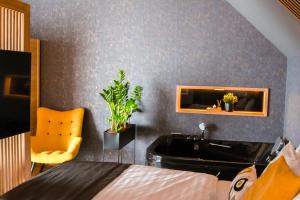 Posteľ alebo postele v izbe v ubytovaní M26 Prémium apartmanok