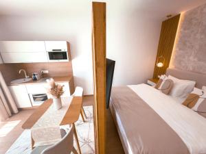 Posteľ alebo postele v izbe v ubytovaní M26 Prémium apartmanok