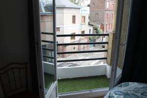a view of a balcony from a bedroom window at Rouen Rive droite in Rouen