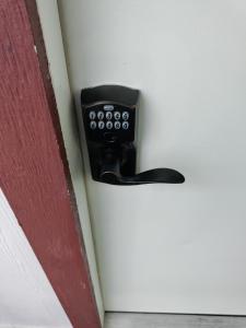 a black door handle sticking out of a door at Make Yourself at Home in Austin