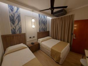 Postel nebo postele na pokoji v ubytování Hotel Internacional