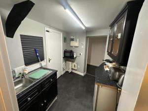 a kitchen with a sink and a counter top at The Stables Room 1 in Takeley