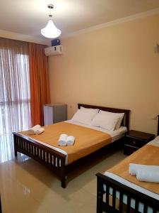 Postel nebo postele na pokoji v ubytování Juz House