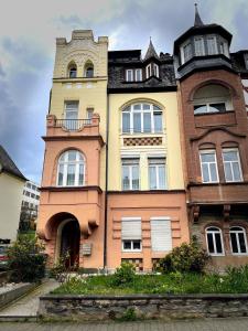 a tall building with a clock tower on top of it at Fewo TRINA in Bernkastel-Kues