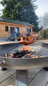 a grill with hot dogs on top of it at black well in Jablonec nad Nisou