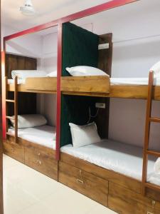 a group of bunk beds in a room at Everest Stays Rooms and Dormitory in Mumbai