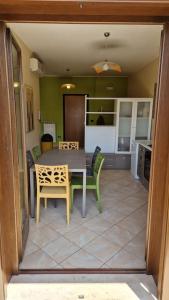 a kitchen and dining room with a table and chairs at Sunny House - by AP Apartment in Gallipoli