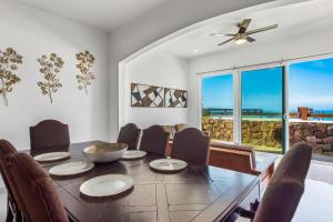 a dining room with a table and chairs at Casa Marfil 26 - Playa Arcangel in Rosarito