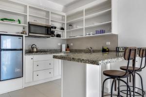 Una cocina o cocineta en Jr Suite 1 - Playa Arcangel