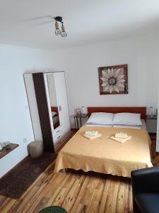 Postel nebo postele na pokoji v ubytování Apartments Toni