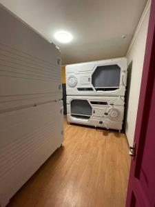 a room with a trailer with a tv in it at Capsula hotel in Yerevan