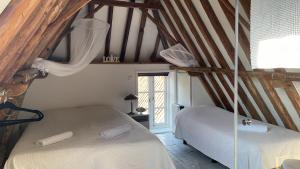 Postel nebo postele na pokoji v ubytování Texel lodge
