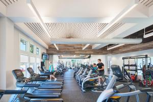 a gym with a lot of cardio machines at Bayside Resort --- 38047 Boxwood Terrace #101 in Selbyville
