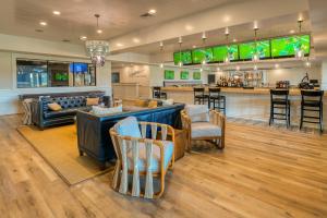 a lobby with a bar and a restaurant at Bayside Resort --- 38047 Boxwood Terrace #101 in Selbyville