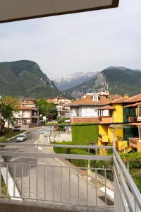 a view from a balcony of a town with mountains at Ophelia - New Modern Apartment with Spectacular Olympus View in Litochoro