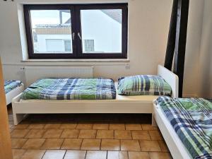 Ένα ή περισσότερα κρεβάτια σε δωμάτιο στο Work & Stay Apartments in Leverkusen